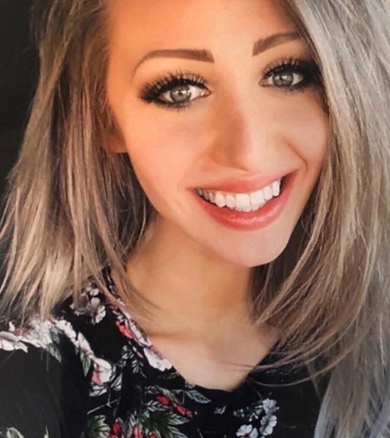 Smiling woman with long, blonde hair.
